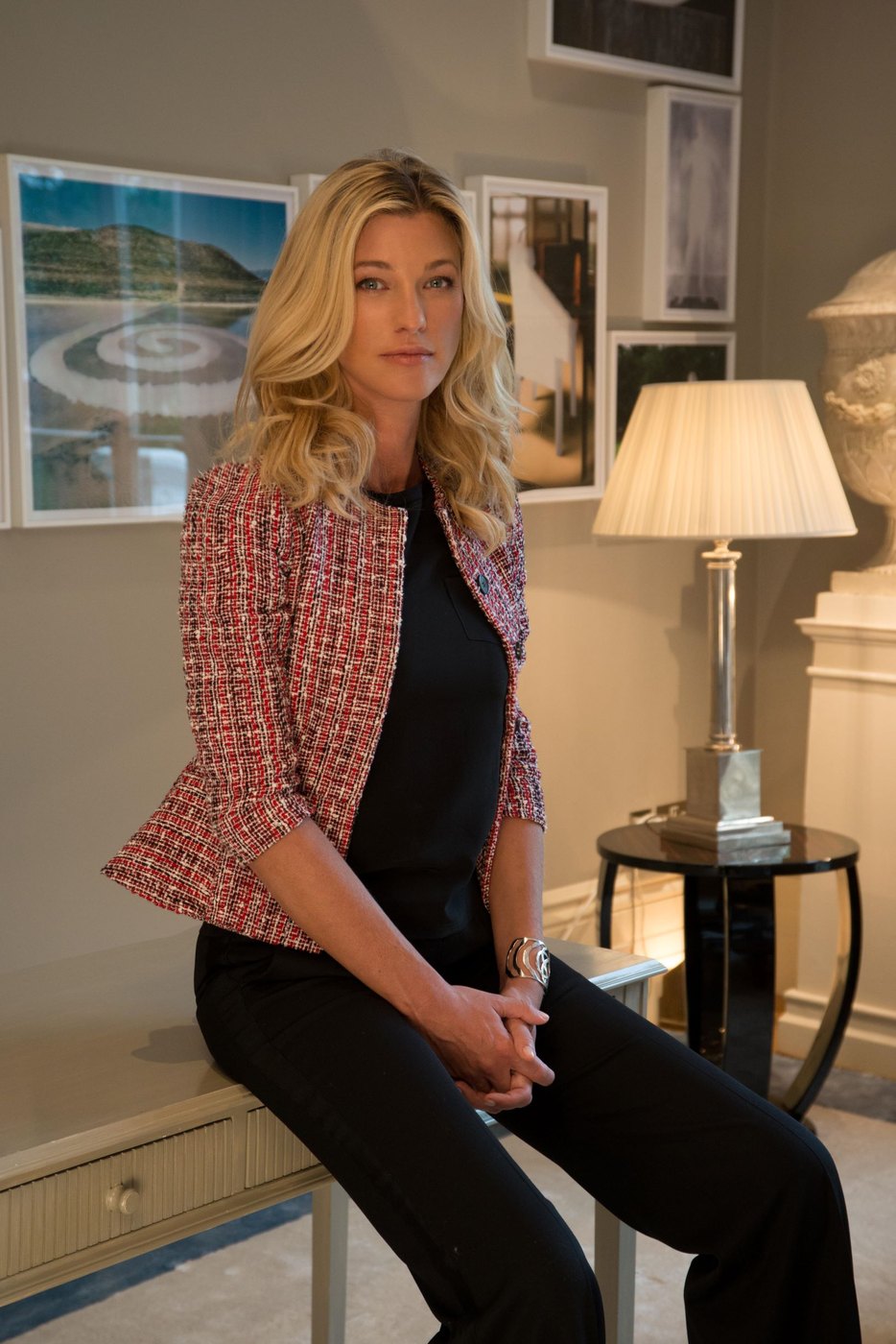 Nicole Junkerman seated in a tweed jacket in a calm room, looking towards the camera