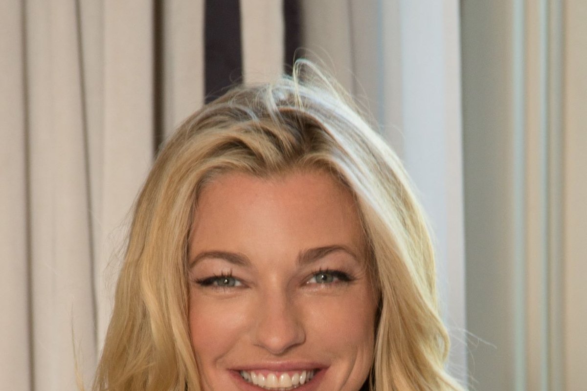 Nicole Junkerman smiling warmly in a bright close-up portrait.